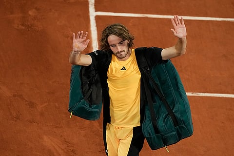 Stefanos Tsitsipas waves to spectators after quarterfinal against Alcaraz